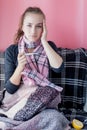 Flu cold grippe. Woman having high temperature. Sick girl with fever checking mercury thermometer on pink background Royalty Free Stock Photo