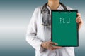 FLU - Female doctor's hand holding medical clipboard and stethoscope on blue blurred background. Concept of Healthcare And Royalty Free Stock Photo