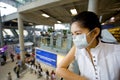 With flu mask at the airport Royalty Free Stock Photo