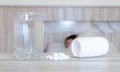 Flu medicine woman Infected With Cold the drug is placed on the table and a glass