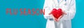 Flu Season theme with a doctor holding a heart Royalty Free Stock Photo