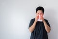 Flu senior Asian woman and using tissue paper,Elderly female sneezing,Copy space for text on white background