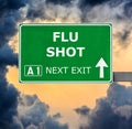 FLU SHOT road sign against clear blue sky Royalty Free Stock Photo