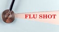 FLU SHOT word made on torn paper, medical concept background