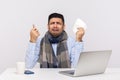 Flu-sick office worker in scarf holding pills, tissue and crying with funny expression, employee feeling unwell