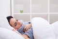 Flu. Woman Suffering From Cold Lying In Bed With Tissue