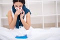 Flu. Woman Suffering From Cold Lying In Bed With Tissue