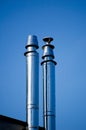 Flue gas chimneys made of stainless steel. Royalty Free Stock Photo