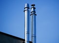 Flue gas chimneys made of stainless steel. Royalty Free Stock Photo