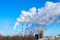 Flue pipes of a bakery and flour factory, industrial area of the city. Air emissions and food production Royalty Free Stock Photo