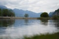 Fluelen municipality in Switzerland with reflections on the water and mountains in the background Royalty Free Stock Photo