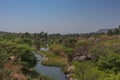 fluent river with rocks and vegetation in Africa. Lubango. Angola.