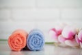 Fluffy bath towels with natural spa ingredients with orchid flowers Royalty Free Stock Photo