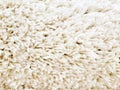 A fluffy, beautiful white shaggy carpet. Royalty Free Stock Photo