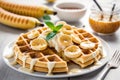Fluffy Belgian buttermilk waffles with glazed bananas, perfect for a delicious breakfast or brunch