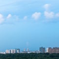 Fluffy cloud in blue dusk sky over city Royalty Free Stock Photo