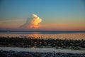 Fluffy cloud over sea on sunset. Tropical island landscape on golden hour. Exotic place sea view with orange blue sky Royalty Free Stock Photo