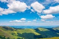 Fluffy clouds above the mountain ridge Royalty Free Stock Photo