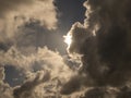 Fluffy clouds over sunset sky. Fluffy cumulus cloud shape photo, gloomy cloudscape background, smoke in the sky Royalty Free Stock Photo