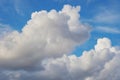 Fluffy clouds are wadded expressive impressive on the blue sky. Heaven, summer atmosphere, relaxation, vacation. Weather forecast Royalty Free Stock Photo