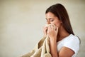 Fluffy and fresh. Shot of young woman enjoying the smell of freshly washed towels. Royalty Free Stock Photo