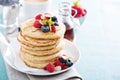 Fluffy oatmeal pancakes stack with fresh berries