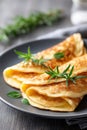 Fluffy omelettes garnished with fresh herbs on a cozy dining table Royalty Free Stock Photo