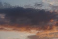 Fluffy orange clouds illuminated by the light coming from the setting sun. Pure nature untouched by man. Climate change from human Royalty Free Stock Photo