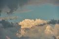 Fluffy orange clouds illuminated by the light coming from the setting sun. Pure nature untouched by man. Climate change from human Royalty Free Stock Photo