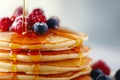 Fluffy Pancakes with Syrup and Berries - Delicious Breakfast Stack