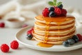 Fluffy Pancakes with Syrup and Berries - Delicious Breakfast Stack