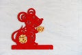 A fluffy paper-cut as symbol of Chinese New Year of the rat stuck to the wall the Chinese means fortune