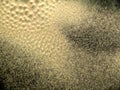 Fluffy sand produced by vibrating surface. Abstract background that looks like sand dunes from another planet