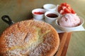 Fluffy Souffle Pancake Served with Strawberry Ice Creme and Chopped Fresh Strawberries for Topping