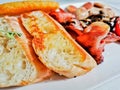 Fluffy Sourdough Bread of Traditional English Big Breakfast with poached egg, sausage, bacon, tomatos, hash brown, mushroom Royalty Free Stock Photo