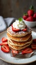 Fluffy Stack of Pancakes Adorned with Fresh Strawberries and a Rich Dollop of Whipped Cream Royalty Free Stock Photo