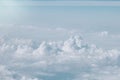 Fluffy white cloud and azure sky seen from airplane, texture. Blue clouds and sky. Natural soft cloudscape background Royalty Free Stock Photo