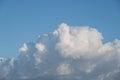 Fluffy white cloud close-up with blue sky
