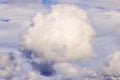 Fluffy white cloud in the sky with soft, diffused sunlight illuminating the edges Royalty Free Stock Photo
