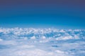 Fluffy white clouds and blue sky with copy space, airplane view