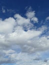 Fluffy white clouds and blue sky