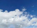 Fluffy white clouds and blue sky