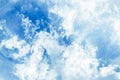 Fluffy white clouds on a clear blue background float in the sky. Spring-summer. Royalty Free Stock Photo