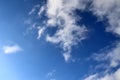 Fluffy white clouds on a clear blue sky