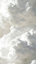 Fluffy white clouds in a clear blue sky, vertical image. Nature and tranquility concept Royalty Free Stock Photo