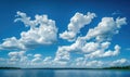 Fluffy white clouds drifting lazily across a brilliant blue sky Royalty Free Stock Photo