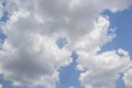 Fluffy white clouds almost filling turqouise blue sky with a little grey - background or replacement