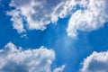 Fluffy white clouds float in the blue sky. Divine view. Background for the concept frankness