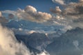 Fluffy white clouds over Sexten Dolomites peaks Sudtirol Italy Royalty Free Stock Photo