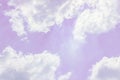 Fluffy white clouds on a pink background float in the sky. Dream.